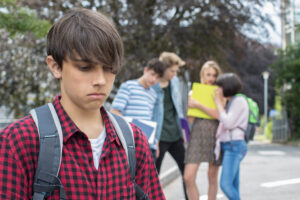 A teenage boy feeling peer pressure.