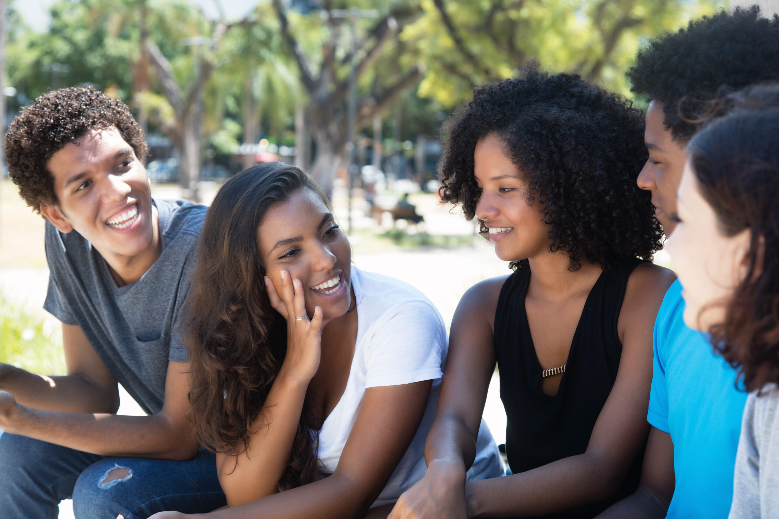 Later,Woman,And,African,Man,Talking,With,Caucasian,Friends