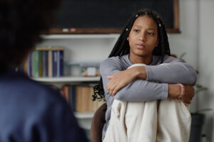 Teen Girl Listening to Therapist or Counsellor