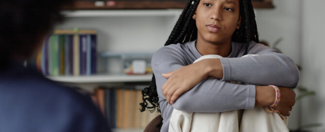 Teen Girl Listening to Therapist or Counsellor