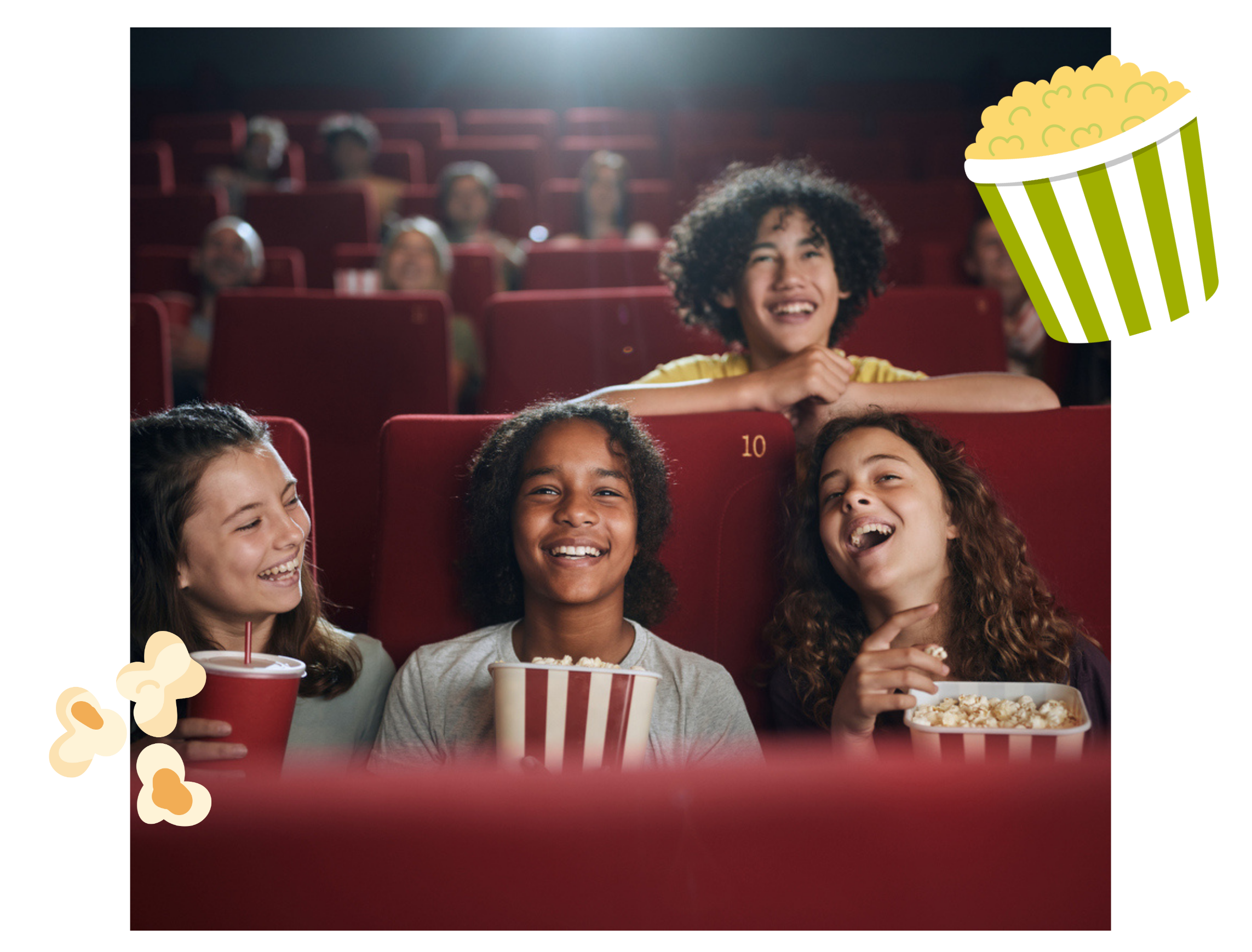 Kids smiling and enjoying a movie in the theatre