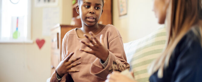 Teen speaking to counselor