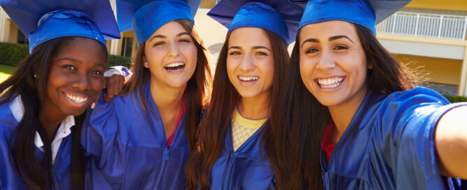 Four teenage girls at graduation