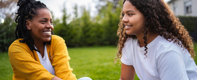 Two friends talking outside